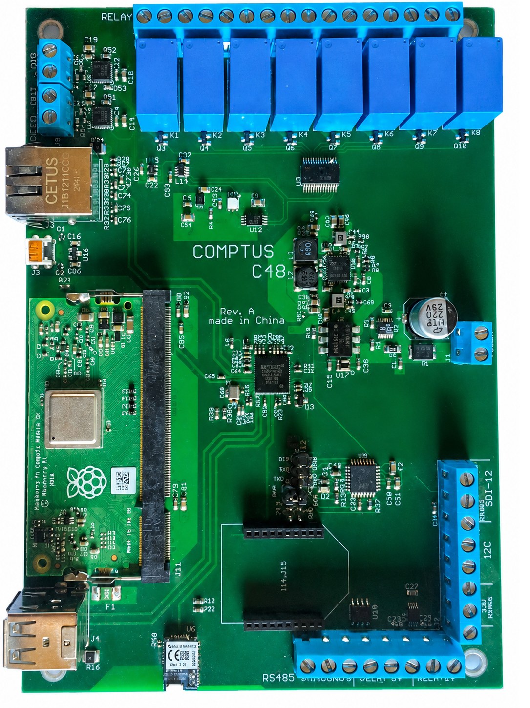Comptus C48 control board with blue relays, terminal blocks, and an integrated Raspberry Pi module.